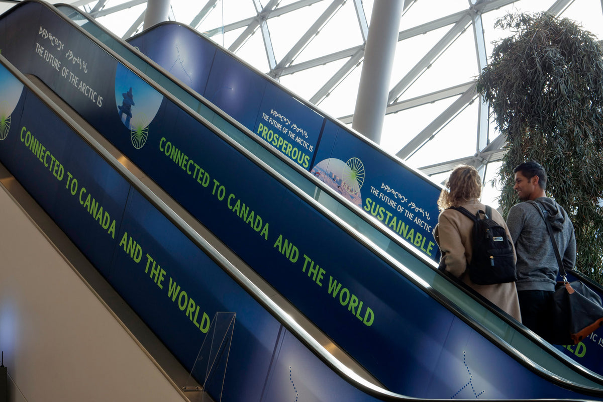 Kivalliq Hydro-Fibre Link campaign advertising by Jackpine on transit escalators.