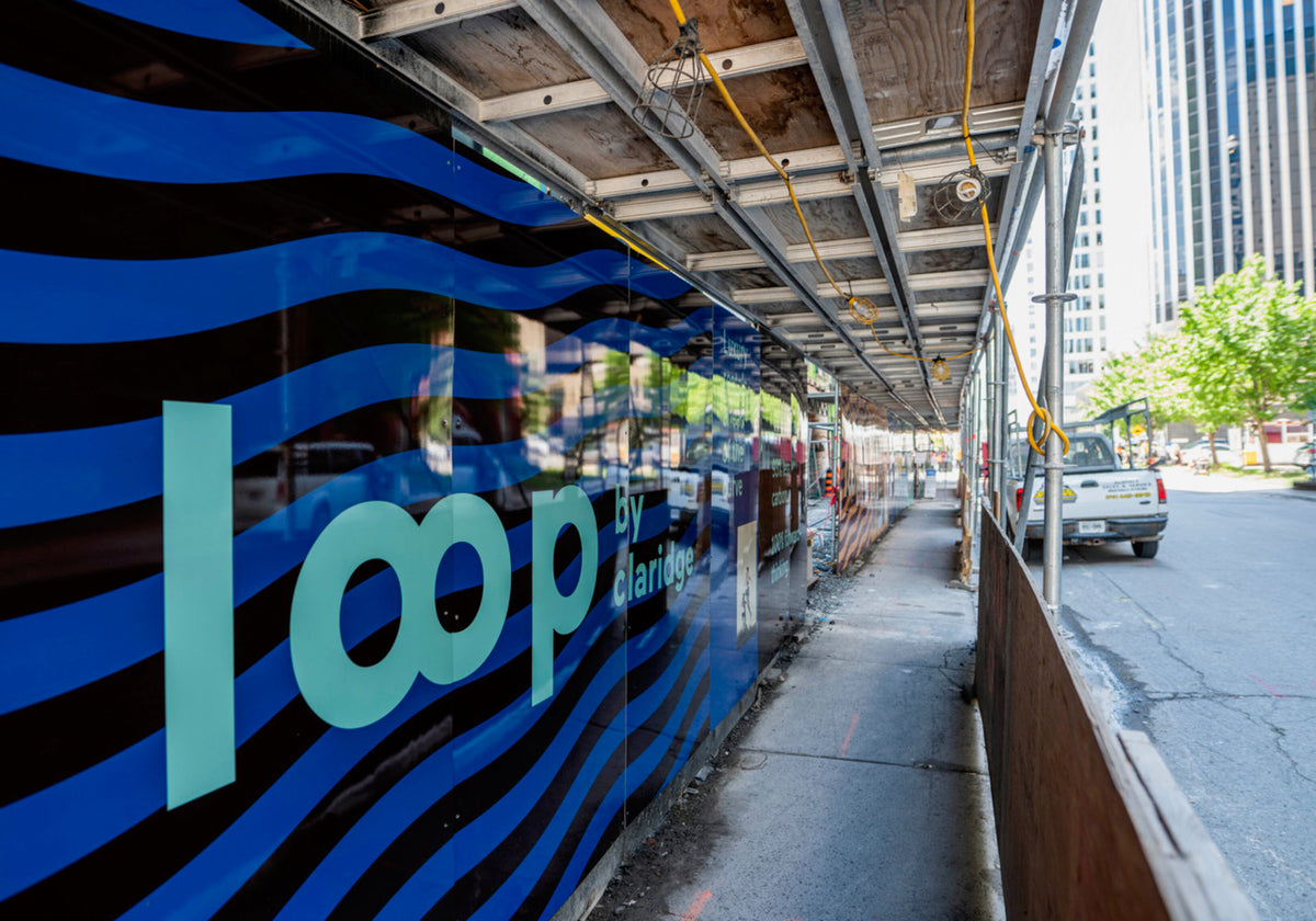 Loop by Claridge construction hoarding in Ottawa, with naming and visual identity by Jackpine.